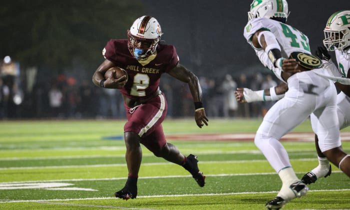 Mill Creek's Cam Robinson looks to get around the edge. 11/13/2023